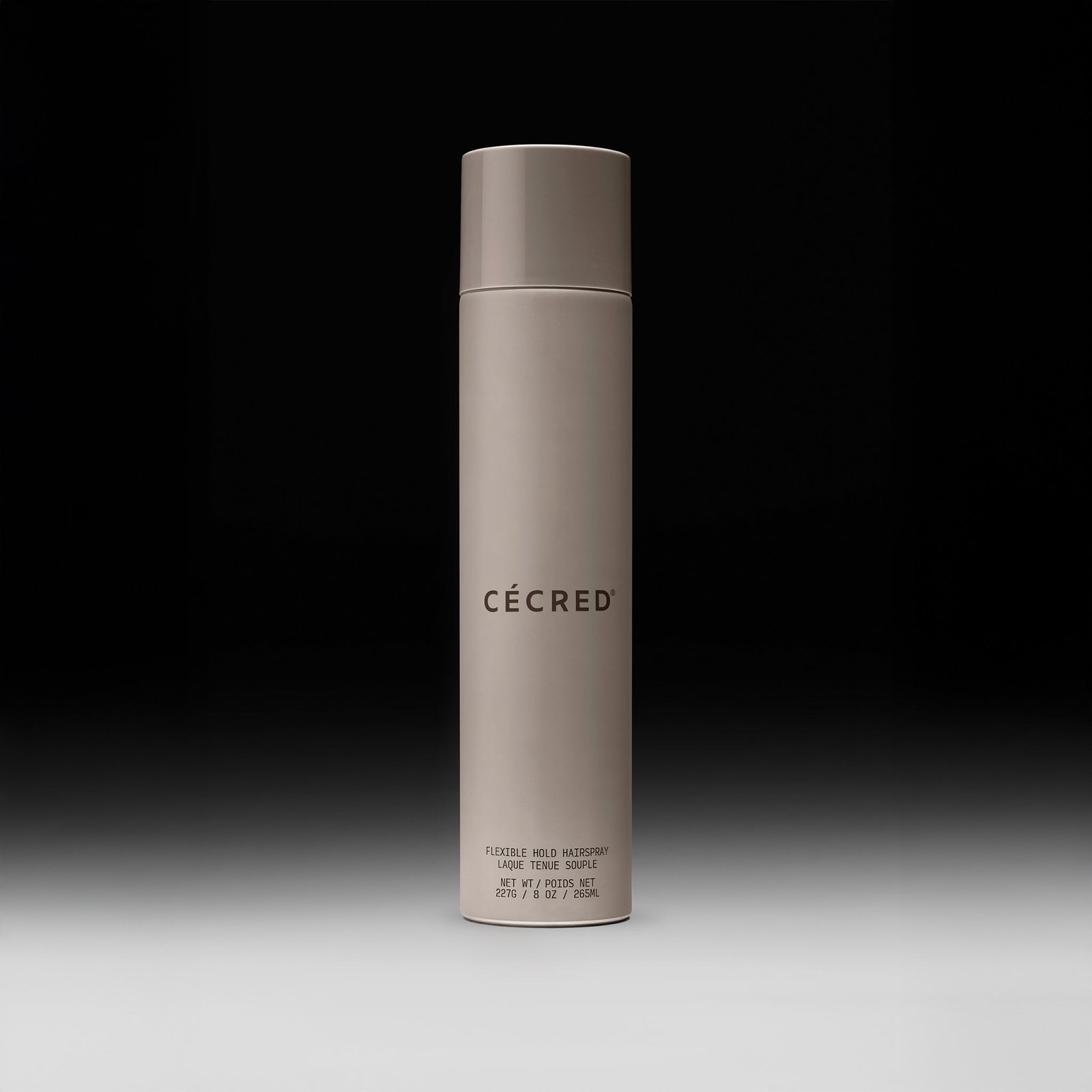Cécred Flexible Hold Hairspray bottle displayed upright on a gradient black-to-white background