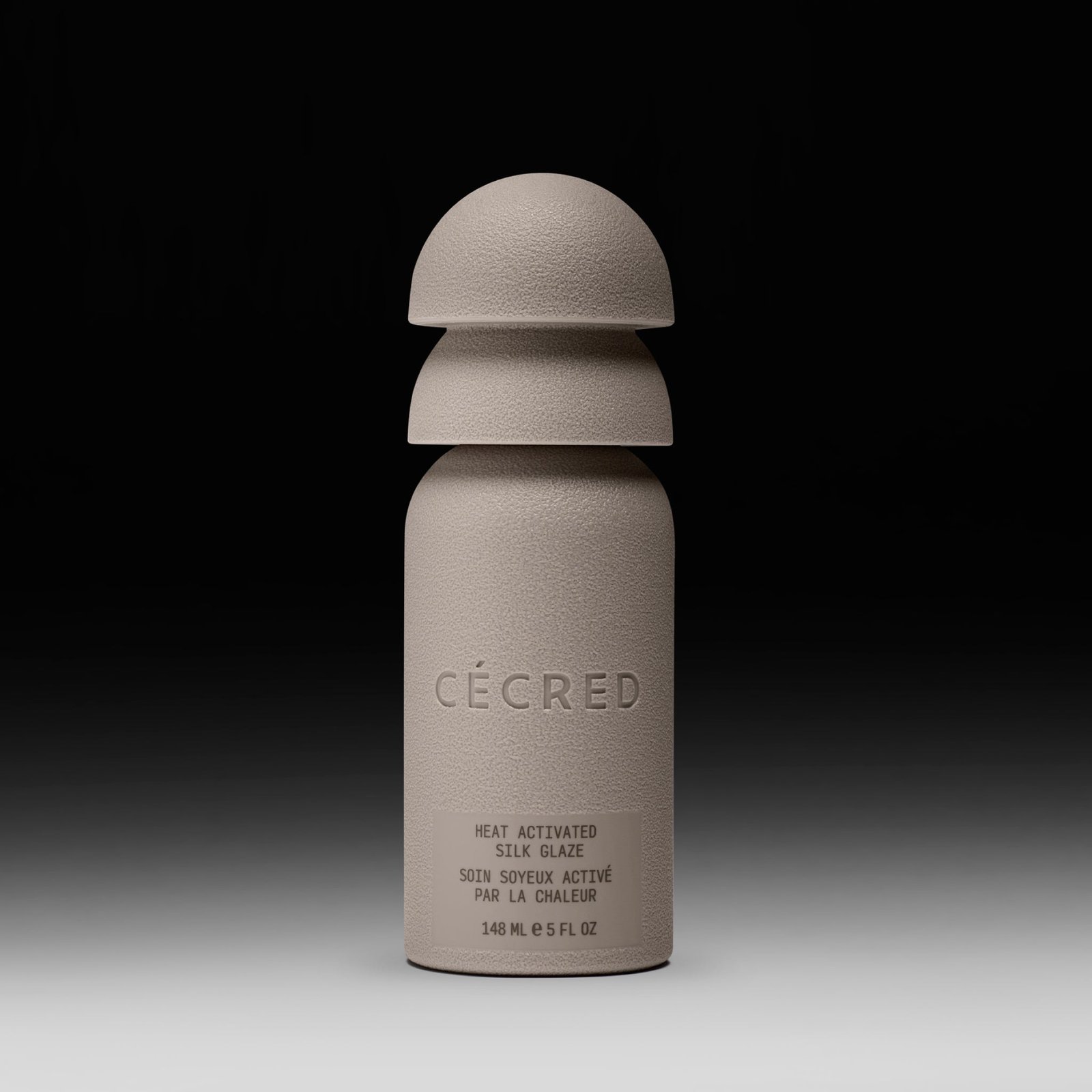 Cécred Heat Activated Silk Glaze bottle displayed upright on a gradient black-to-white background