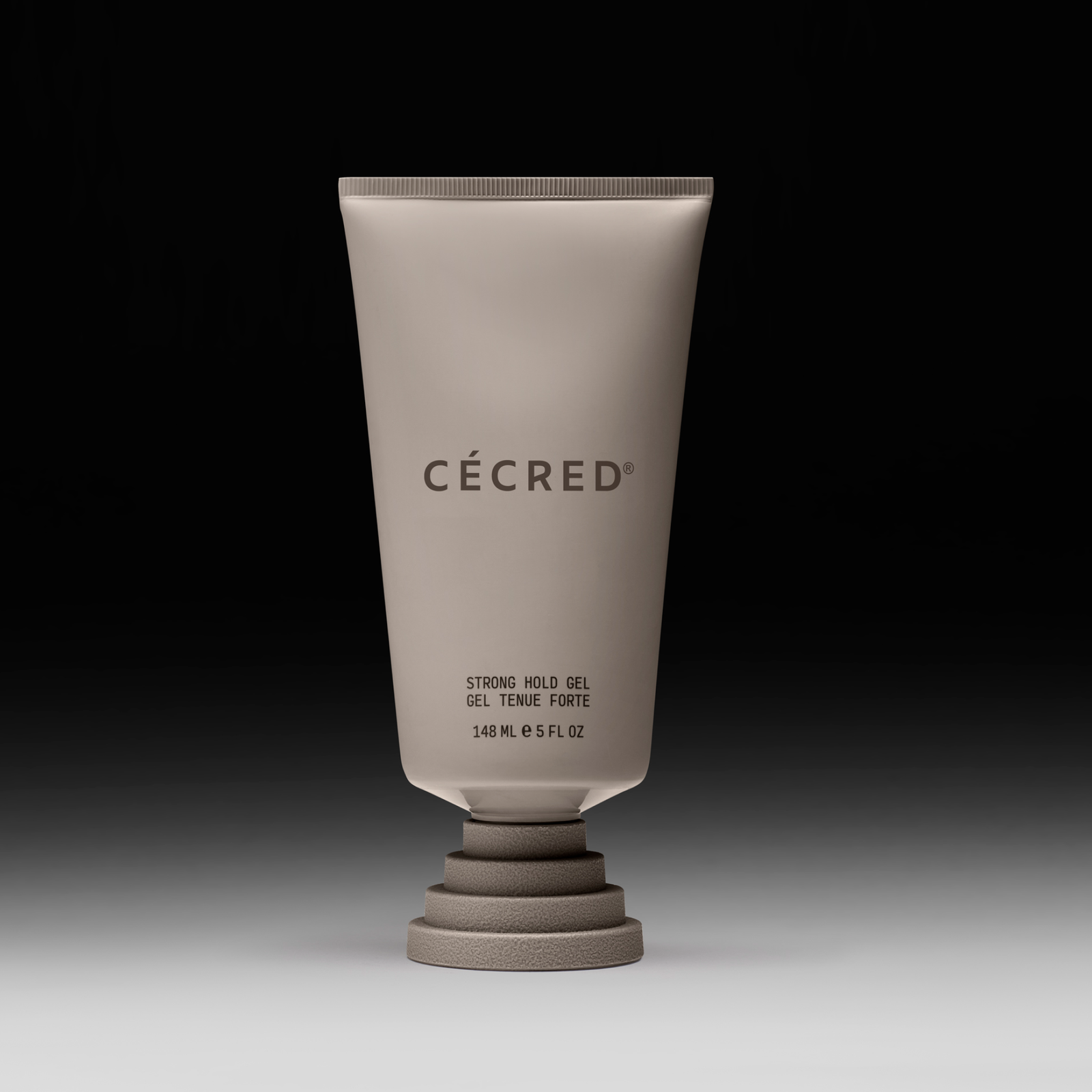 Cécred Strong Hold Gel bottle displayed upright on a gradient black-to-white background