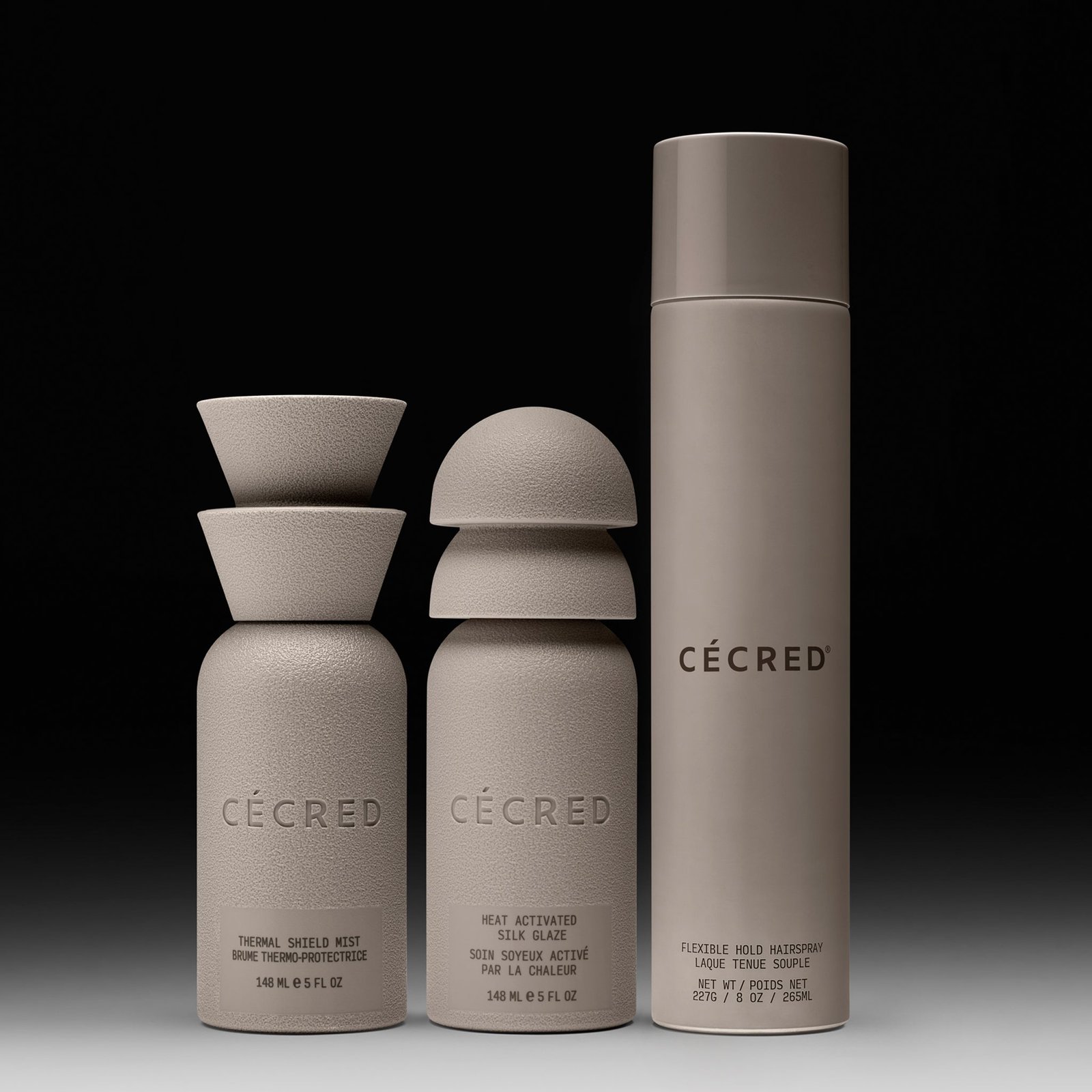 Cécred Silk Glaze Look Bundle on a black background — three styler bottles